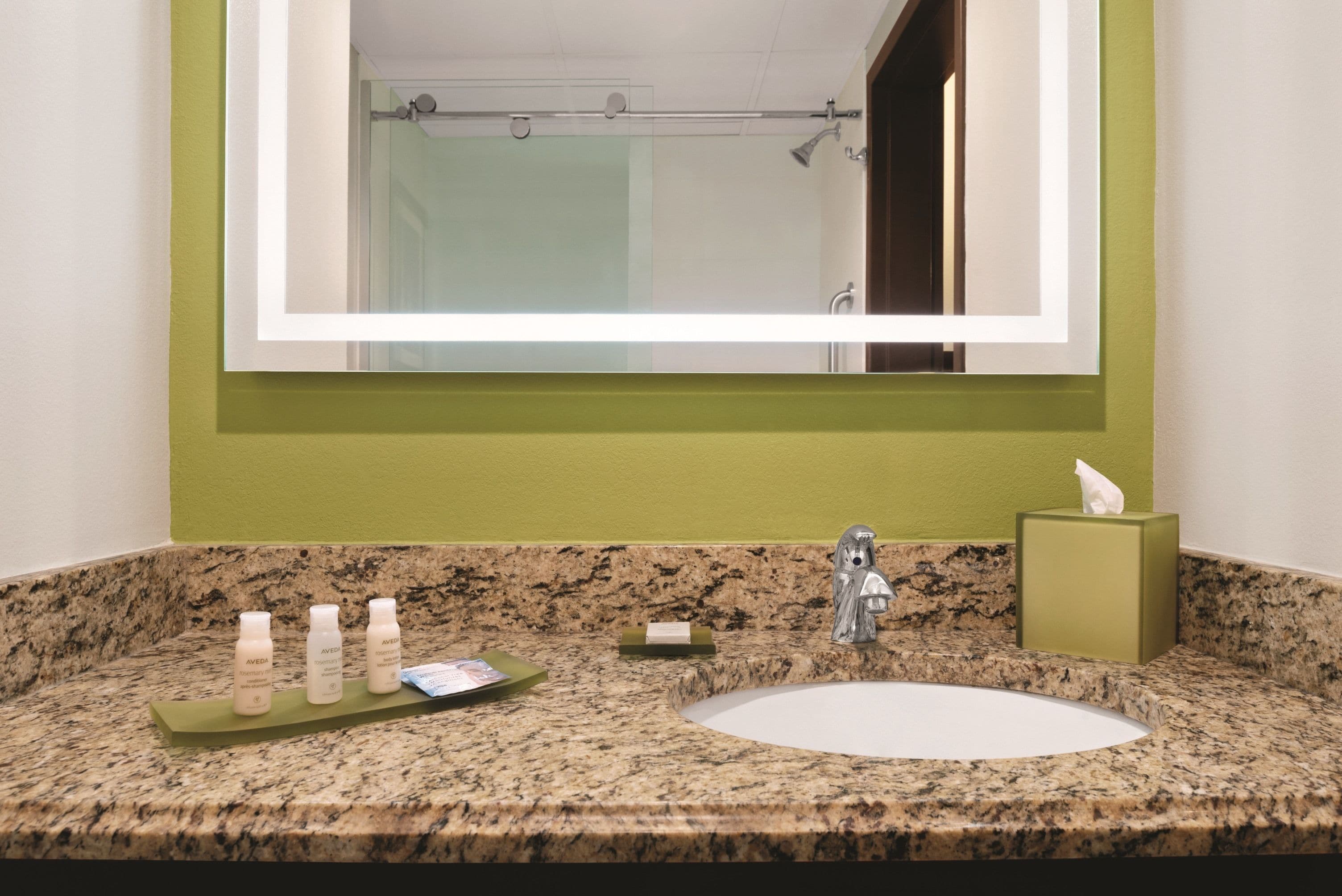 combined shower/bathtub, designer toiletries, hair dryer, towels