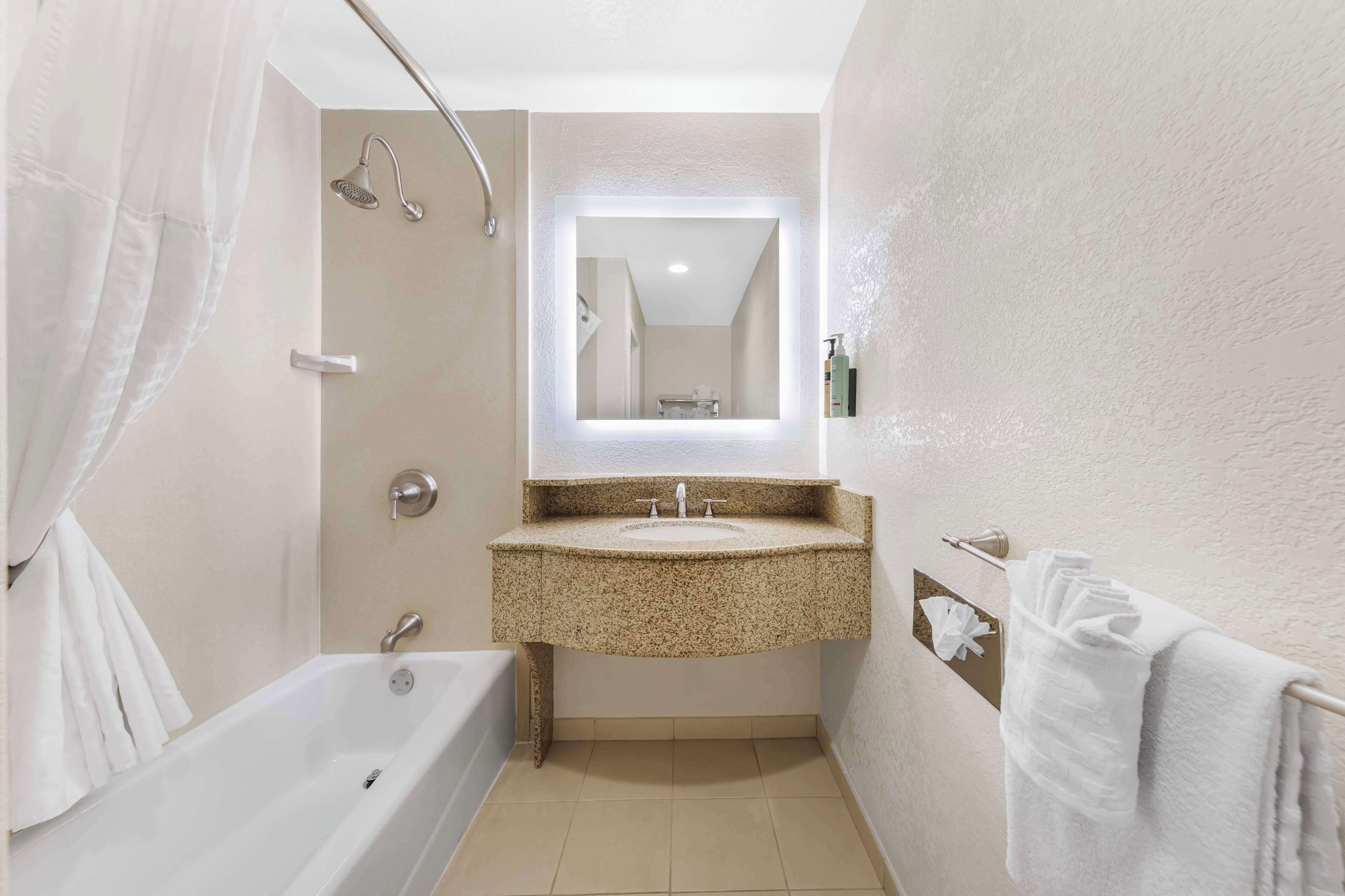 standard room, 2 queen beds, non smoking, refrigerator & microwave | bathroom | combined shower/bathtub, free toiletries, hair dryer, towels