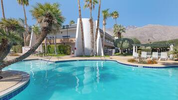 2 outdoor pools, open 7:00 AM to 10:00 PM, pool umbrellas, pool loungers