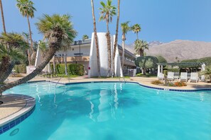 2 outdoor pools, open 7:00 AM to 10:00 PM, pool umbrellas, pool loungers