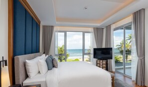A hotel room with a large bed, a flat-screen TV, and a view of the ocean. - Angsana Laguna Phuket (Choeng Thale)