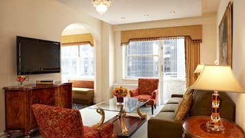 Luxury Two Bedroom Suite | Living area | 42-inch plasma TV with cable channels, TV, iPod dock