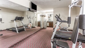 A gym with treadmills, elliptical machines, and weight equipment. - Ramada Limited Norfolk (Norfolk)