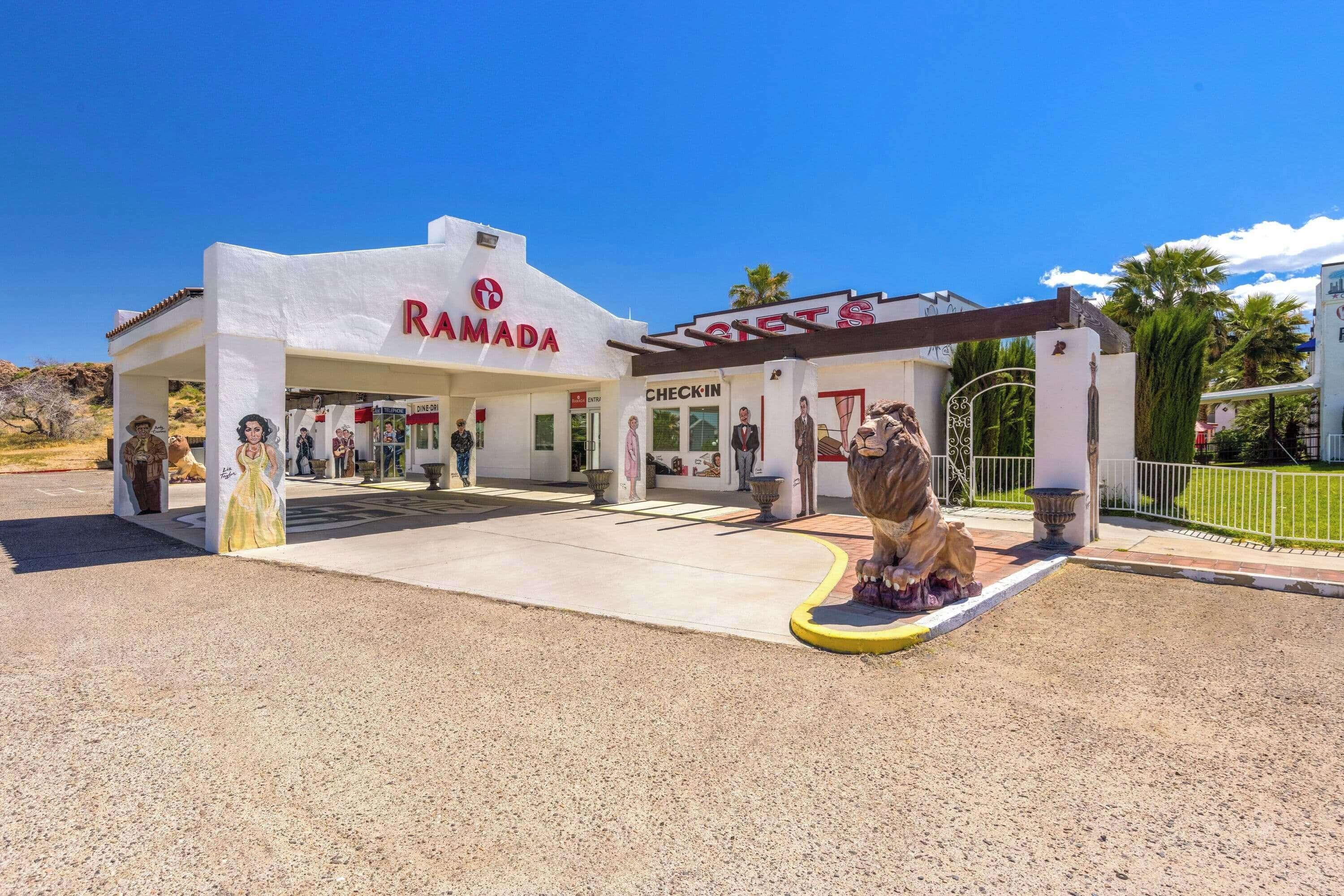 A building with a white facade and a sign reading "RAMADA".