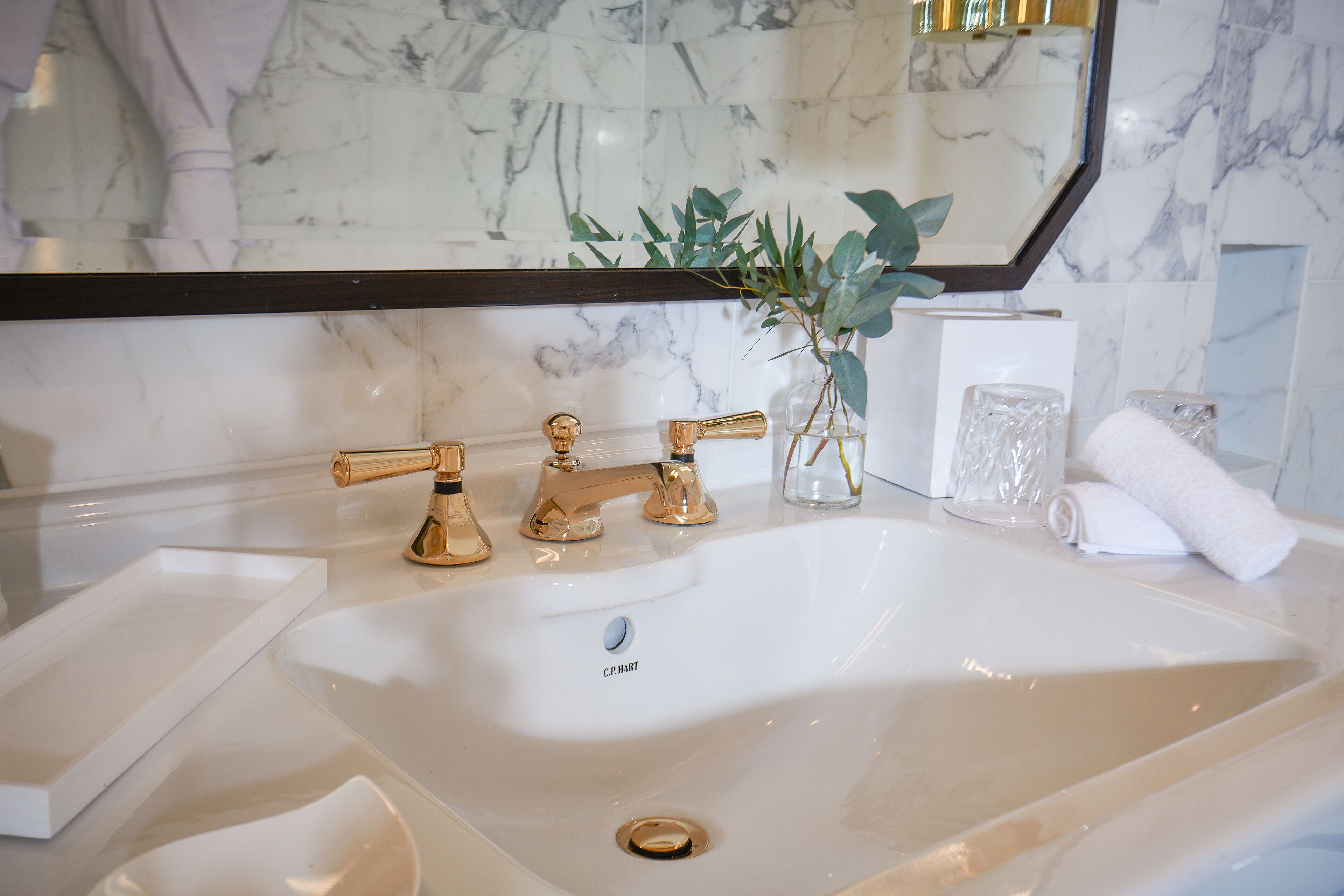 designer toiletries, hair dryer, bathrobes, slippers