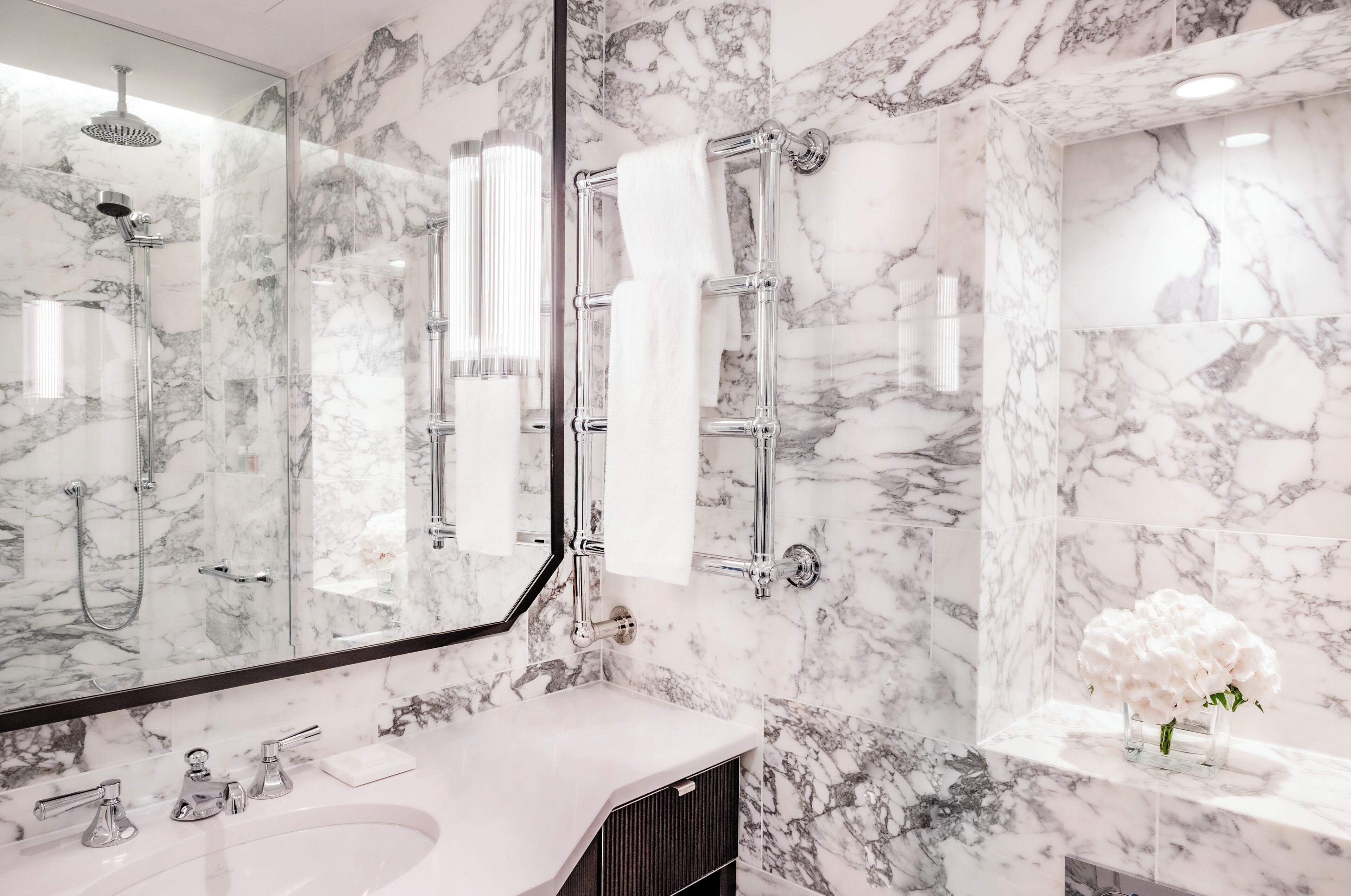 Designer toiletries, hair dryer, bathrobes, slippers