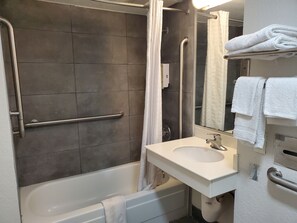 Room, 1 King Bed, Accessible, Non Smoking | Bathroom | Combined shower/bathtub, free toiletries, towels, soap