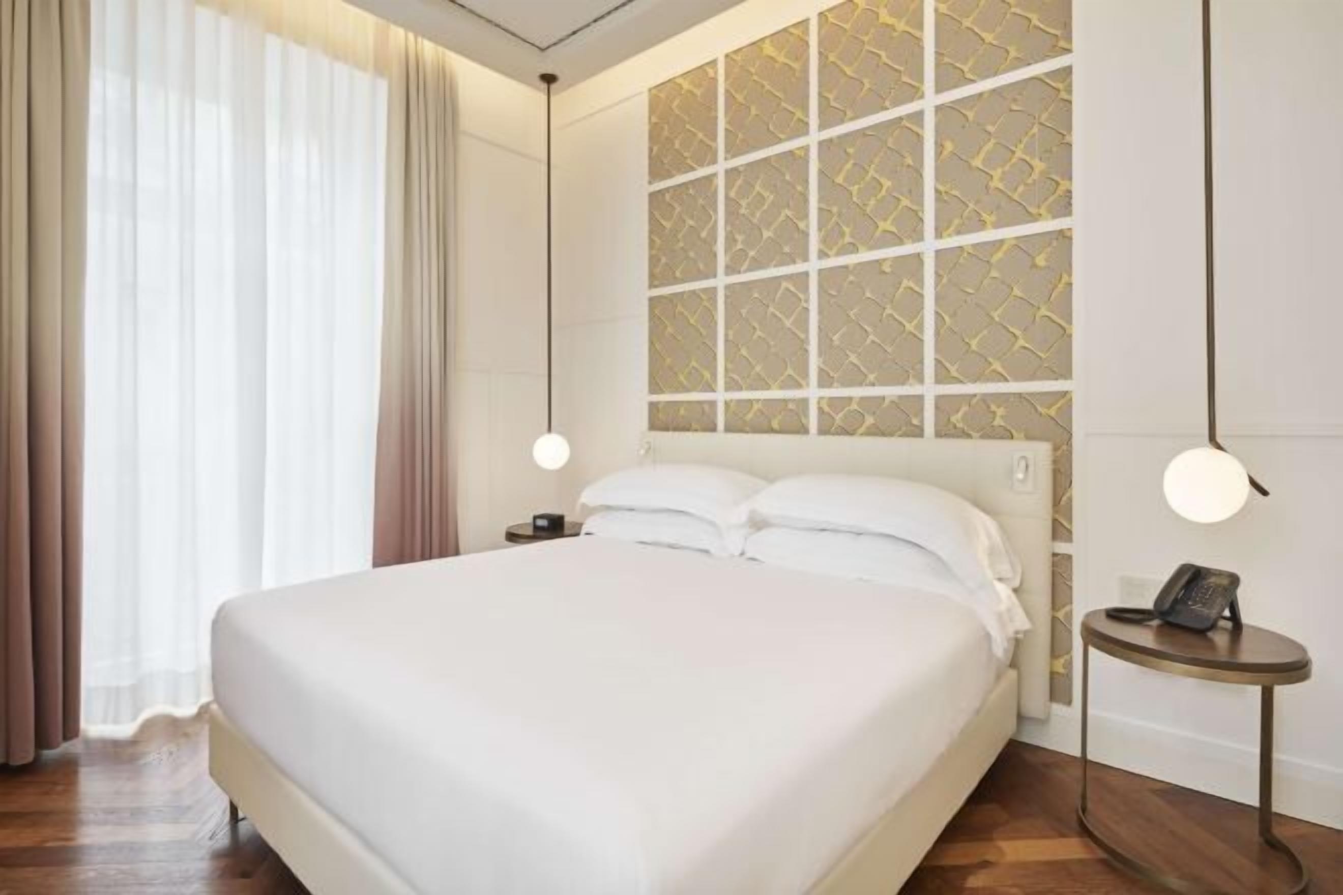 Premium bedding, down comforters, memory foam beds, minibar