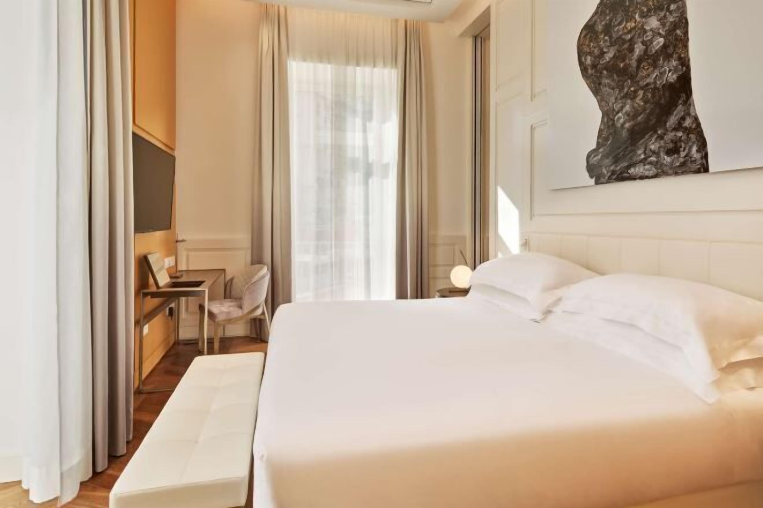 Premium bedding, down comforters, memory foam beds, minibar