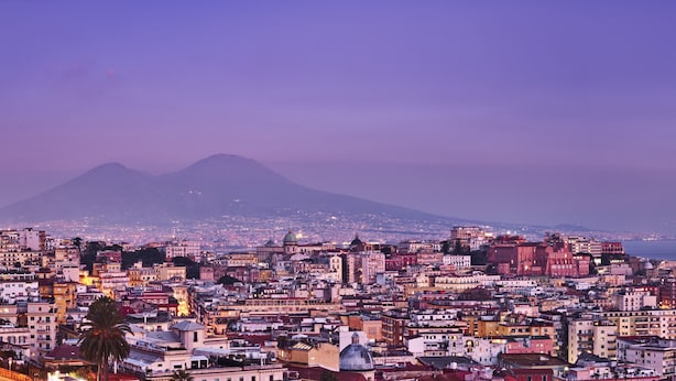A cityscape with a view of mountains in the background. - De Bonart Naples, Curio Collection by Hilton (Naples)