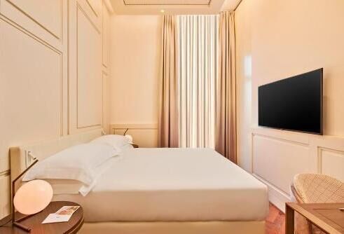 Premium bedding, down comforters, memory foam beds, minibar