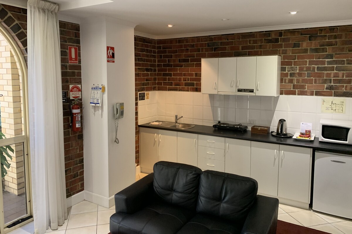 Suite 40 - 1 Bedroom with Kitchenette  | Living area | 32-inch LCD TV with premium channels, TV, iPod dock