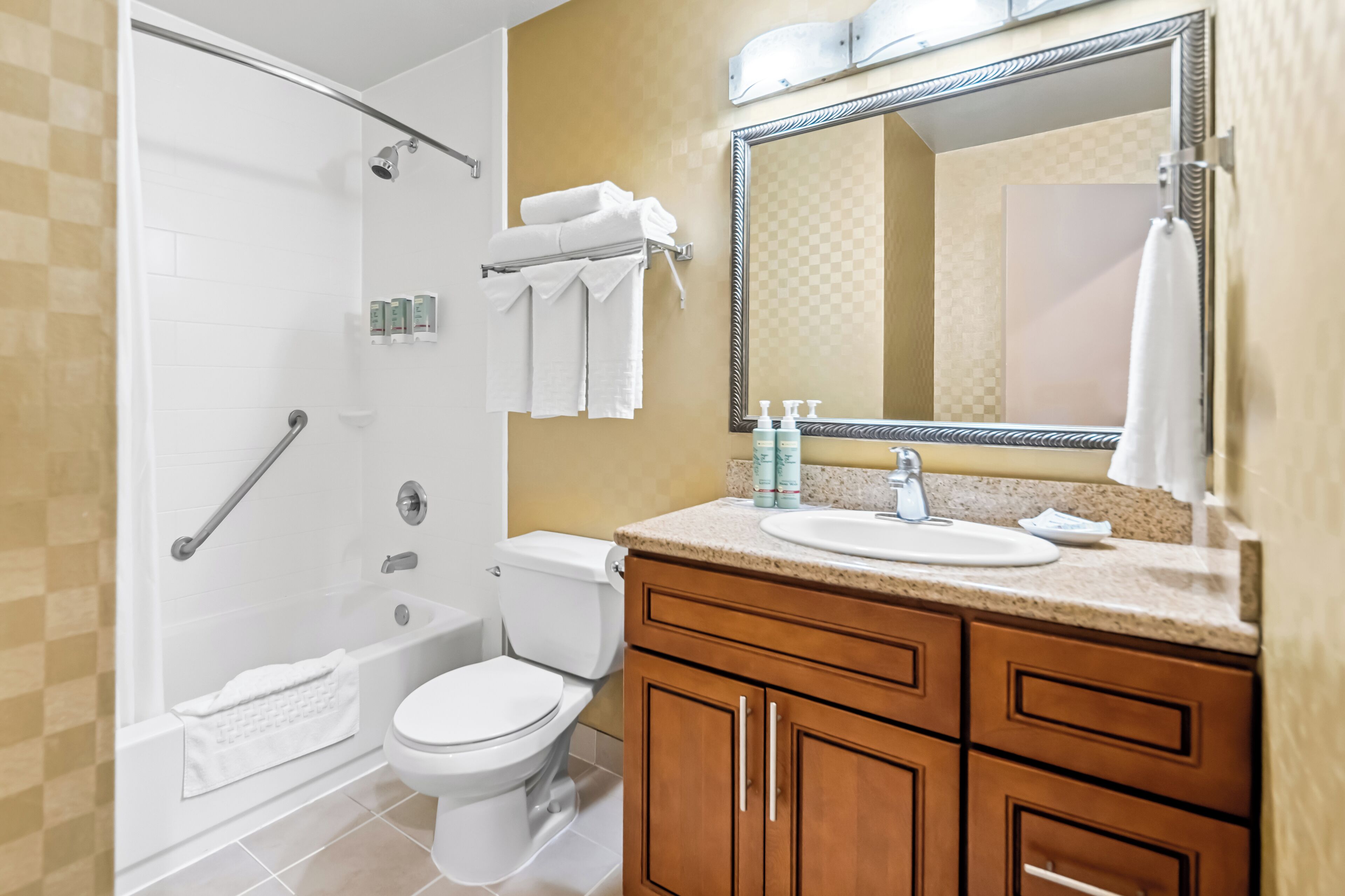 suite, 1 king bed, non smoking (living room) | bathroom | combined shower/bathtub, free toiletries, hair dryer, towels