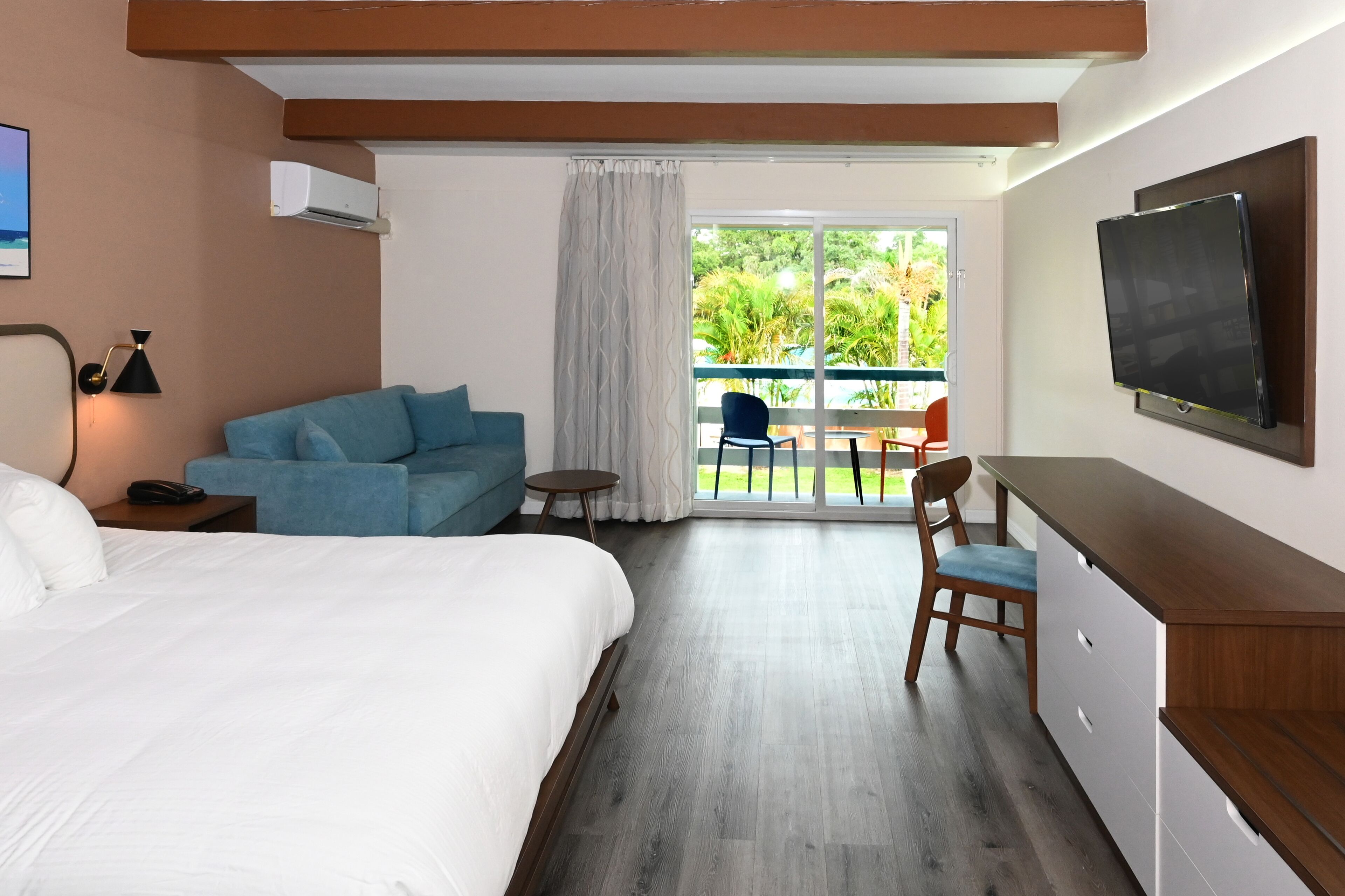 premium room, 1 king bed, balcony/patio pool view | premium bedding, down duvets, pillow-top beds, desk