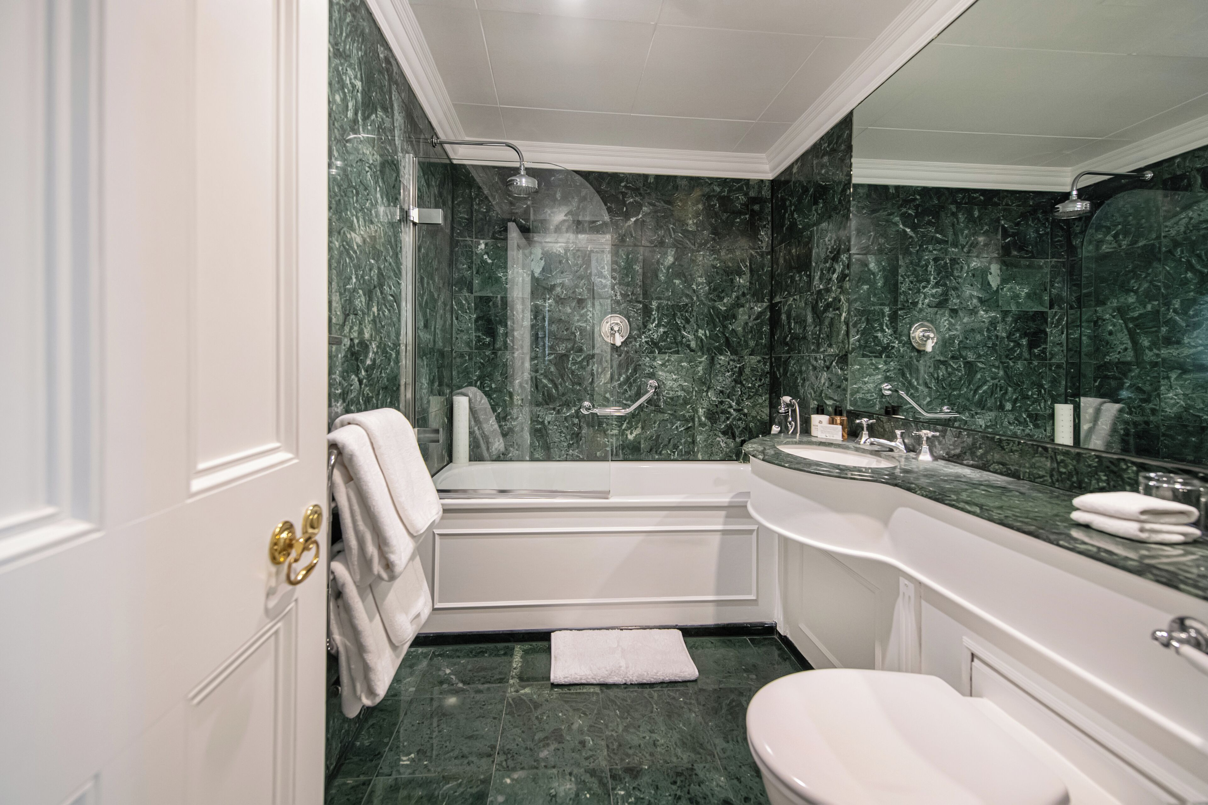 designer toiletries, hair dryer, bathrobes, slippers