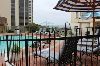 Outdoor pool, open 7:00 AM to 10:00 PM, pool umbrellas, sun loungers at Grande Colonial Hotel