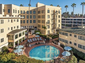 Outdoor pool, open 7:00 AM to 10:00 PM, pool umbrellas, pool loungers