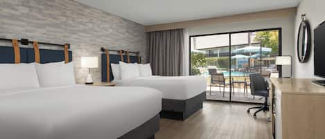 Room, 2 Queen Beds, Patio, Pool View | Hypo-allergenic bedding, in-room safe, desk, laptop workspace