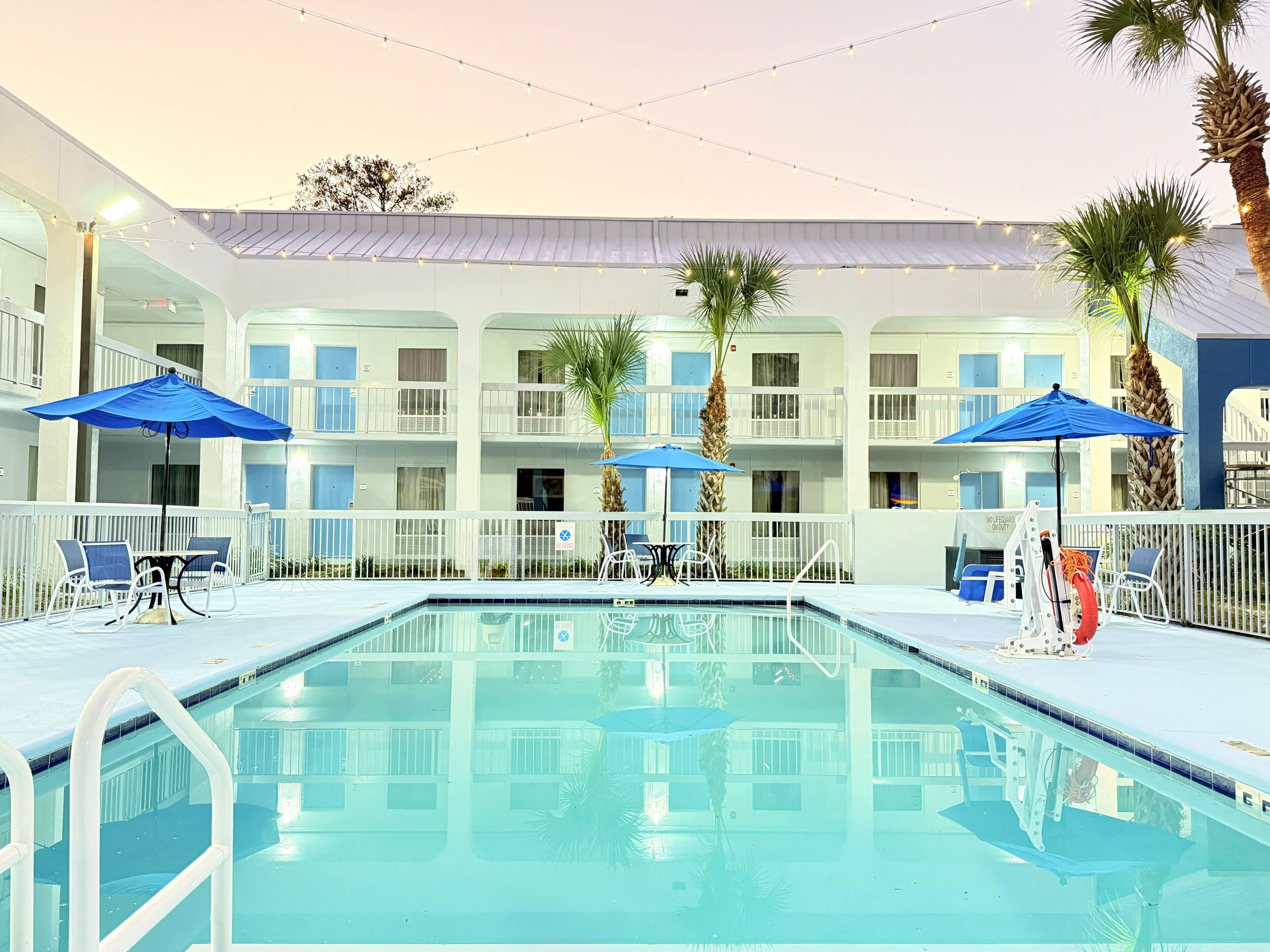 Outdoor pool, open 8 AM to 8:00 PM, pool umbrellas