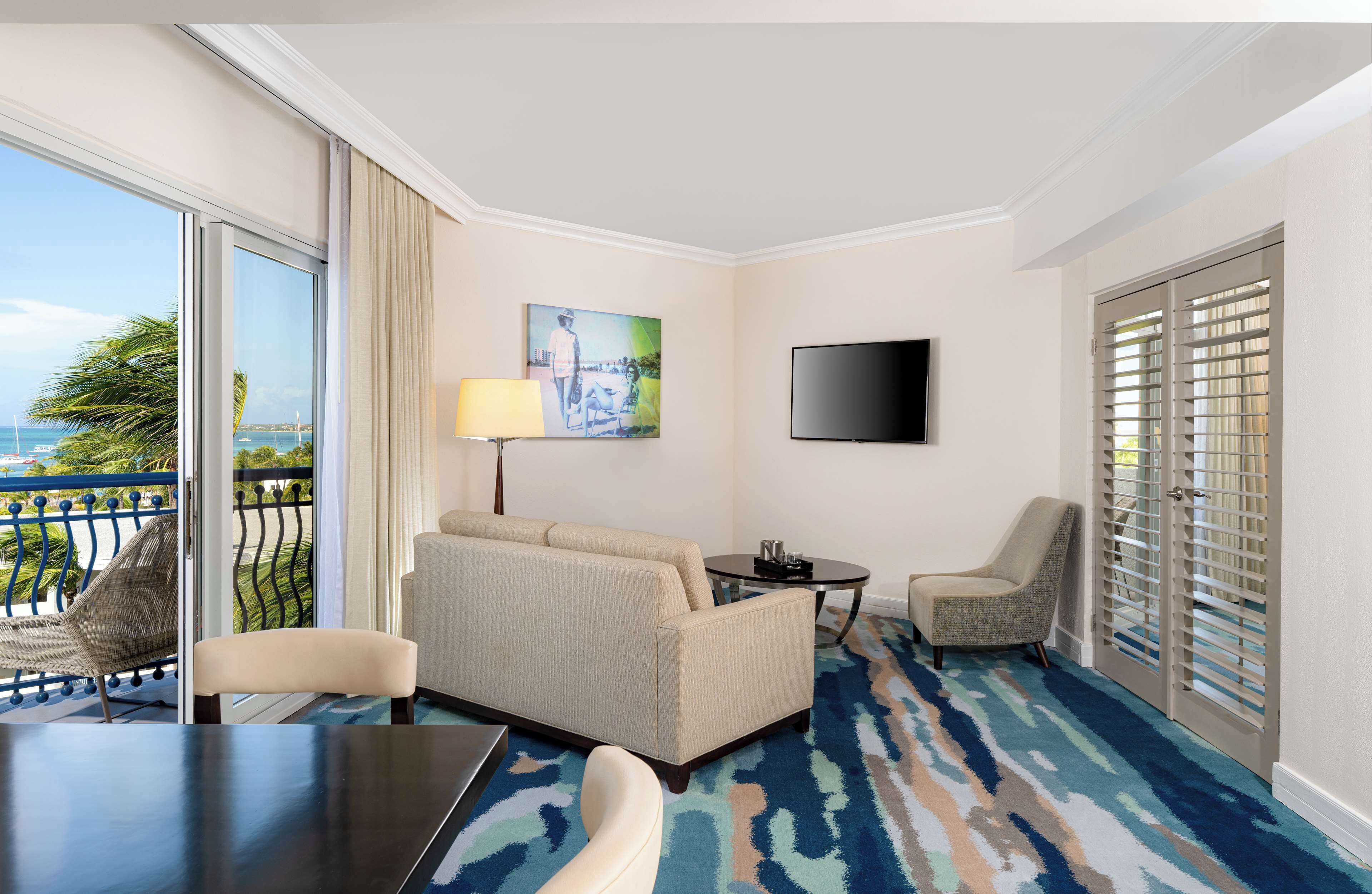 premium suite, 1 king bed (curacao tower) | living area | 50-inch led tv with cable channels, tv, ipod dock