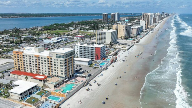 A coastal hotel with multiple buildings, a beach, and a pool area. - Residence Inn by Marriott Daytona Beach Oceanfront (Daytona Beach Shores)