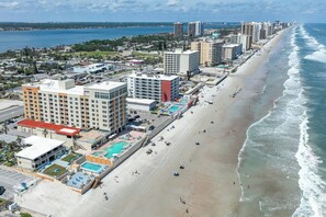 A coastal hotel with multiple buildings, a beach, and a pool area. - Residence Inn by Marriott Daytona Beach Oceanfront (Daytona Beach Shores)