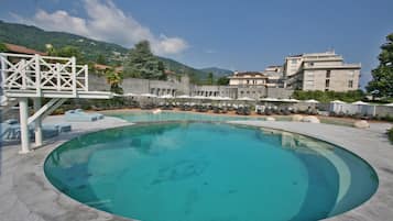 Indoor pool, seasonal outdoor pool, pool umbrellas, pool loungers