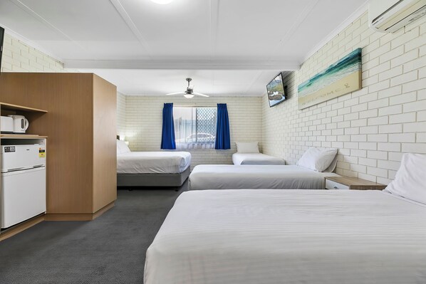 Standard Room, Multiple Beds, Non Smoking (Upgrade) | Desk, laptop workspace, blackout drapes, iron/ironing board