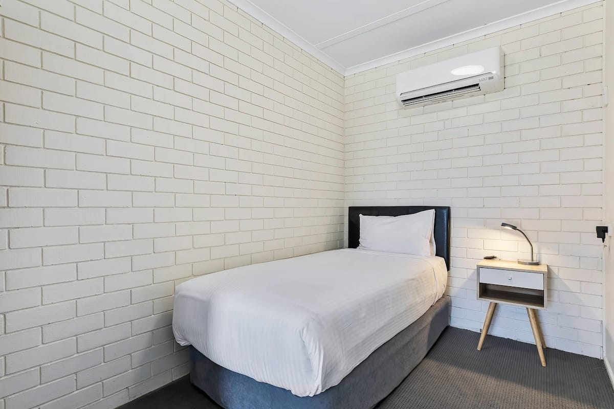 Standard Room, Multiple Beds, Non Smoking (Upgrade) | Desk, laptop workspace, blackout drapes, iron/ironing board