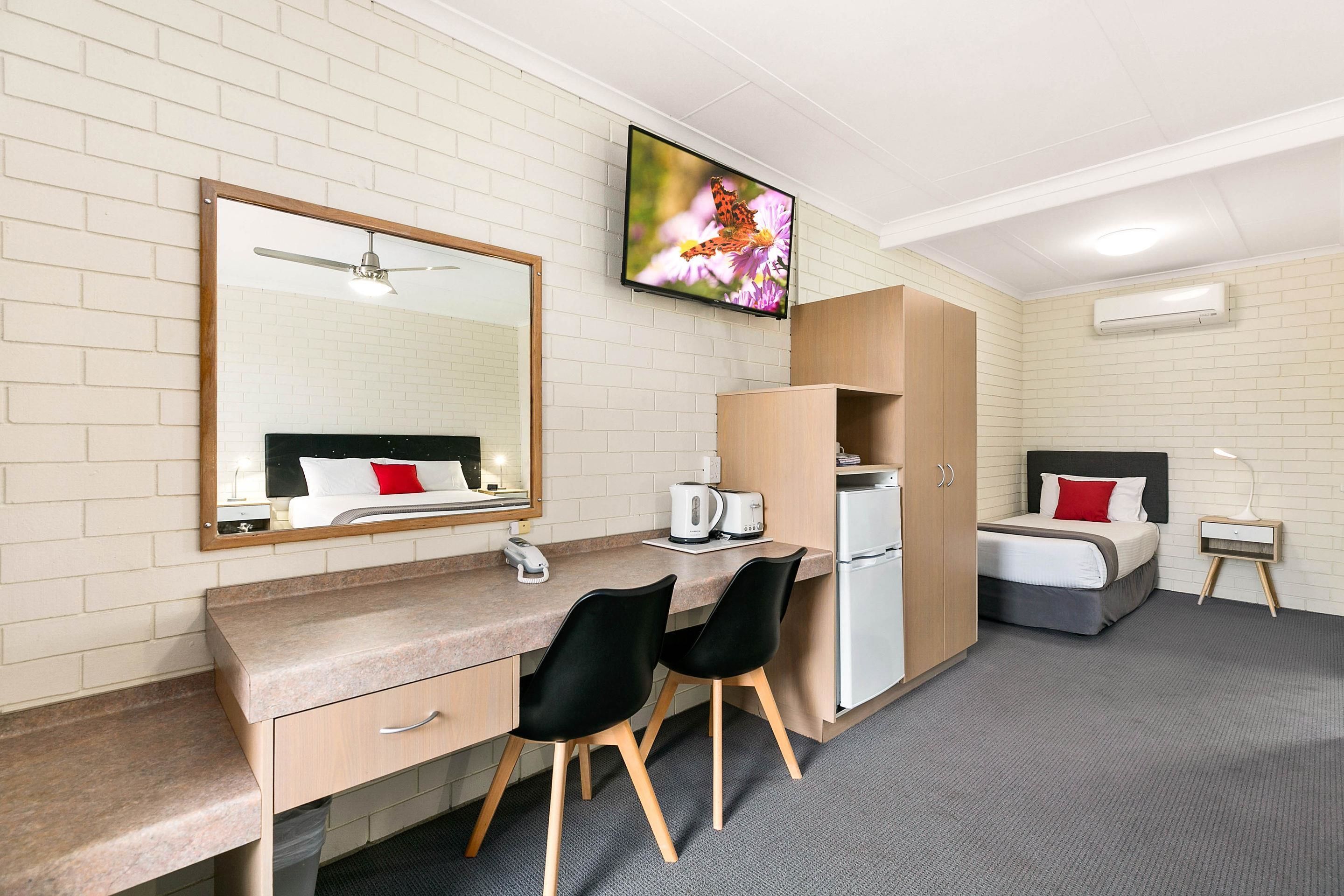 suite standard single room, non smoking | desk, laptop workspace, blackout curtains, iron/ironing board