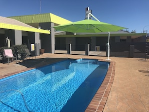 Outdoor pool, open 8 AM to 7:00 PM, pool umbrellas, pool loungers