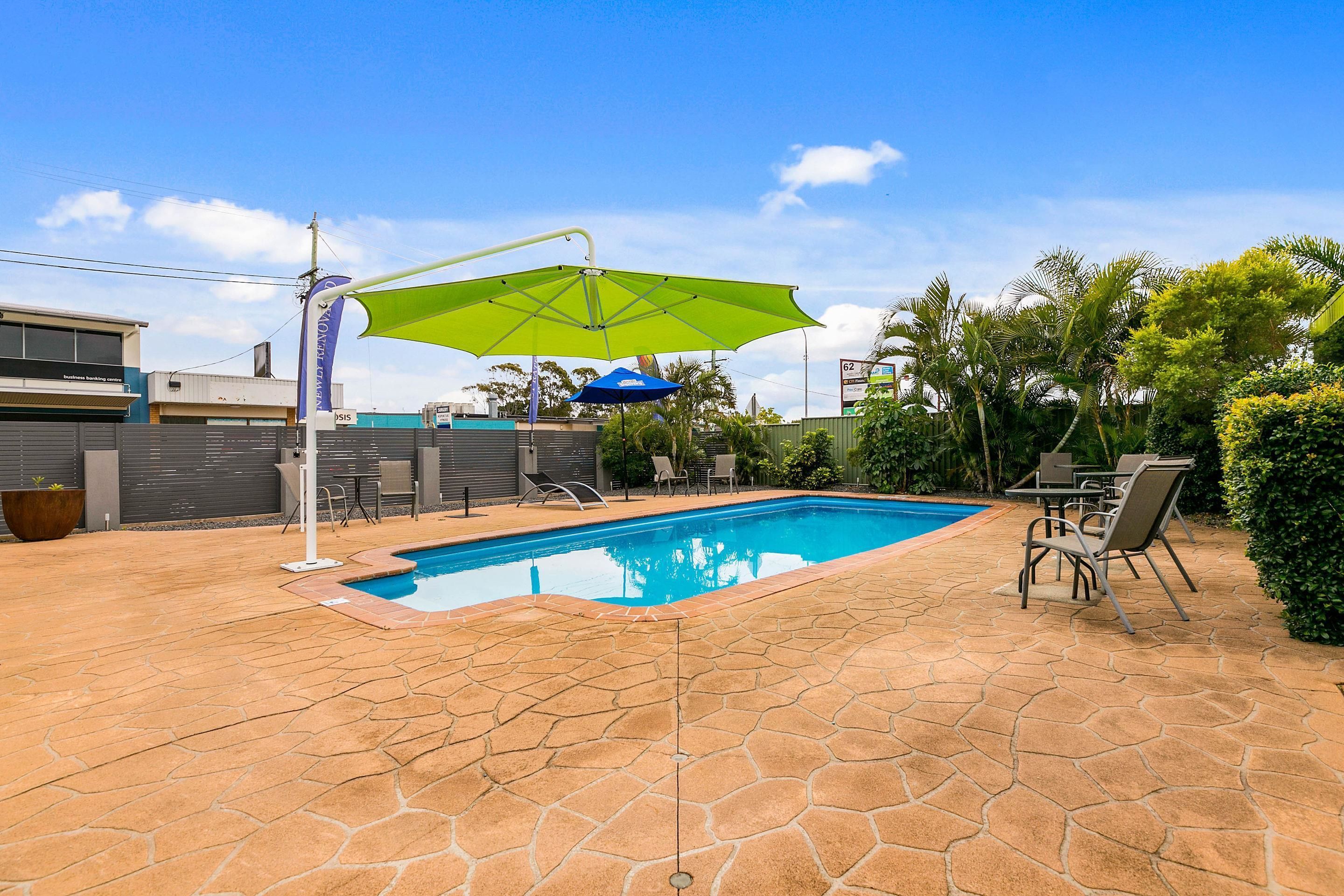 outdoor pool, open 8 am to 7:00 pm, pool umbrellas, pool loungers