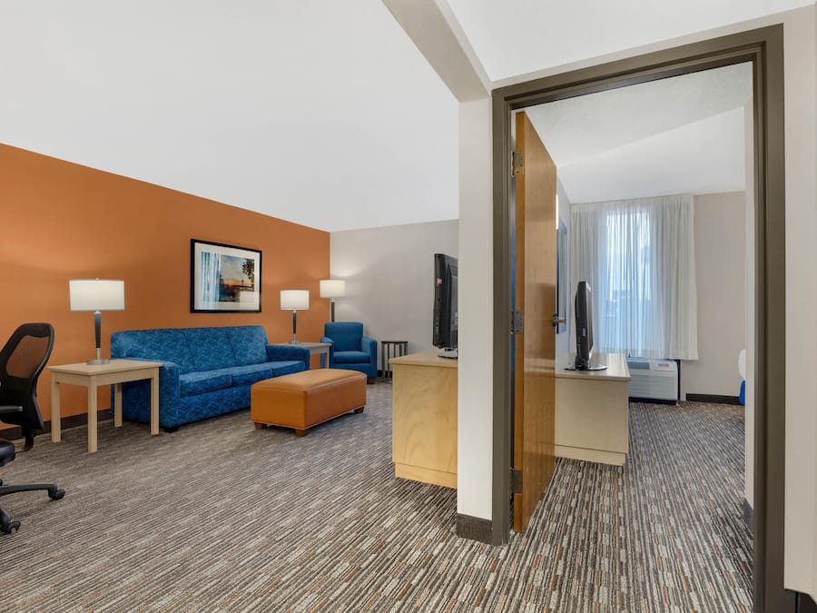 Desk, laptop workspace, blackout drapes, free cribs/infant beds