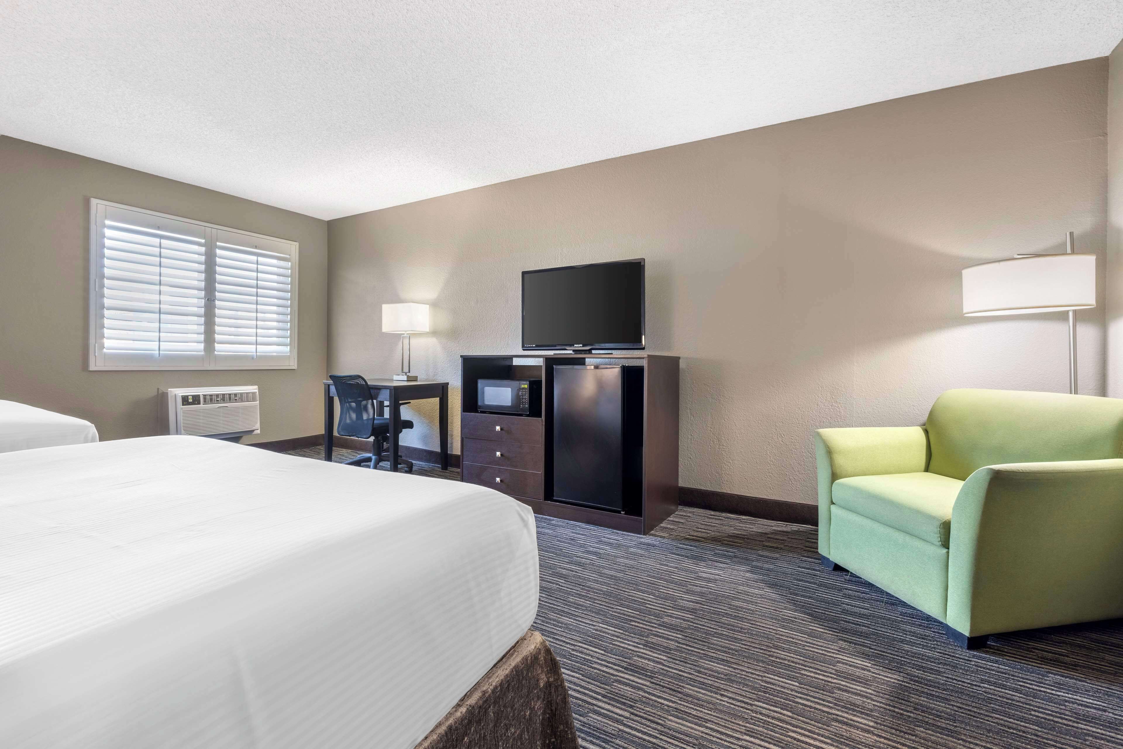 suite, 2 queen beds, non smoking, refrigerator & microwave (separate living room;with sofabed) | in-room safe, individually decorated, desk, laptop workspace