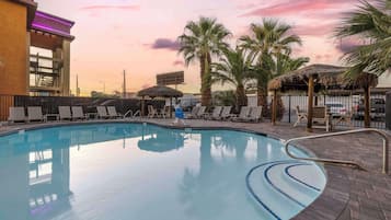 Outdoor pool, open 9:00 AM to 9:00 PM, pool umbrellas, pool loungers