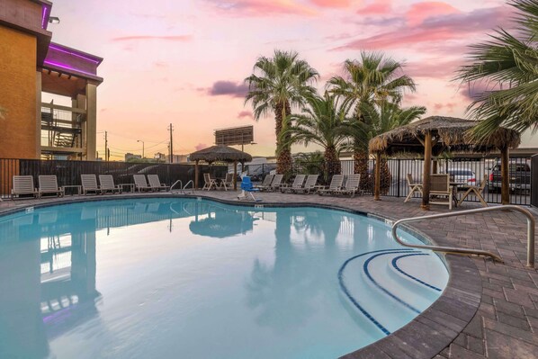 Outdoor pool, open 9:00 AM to 9:00 PM, pool umbrellas, sun loungers
