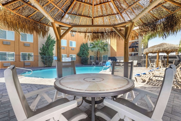 Outdoor pool, open 9:00 AM to 9:00 PM, pool umbrellas, sun loungers