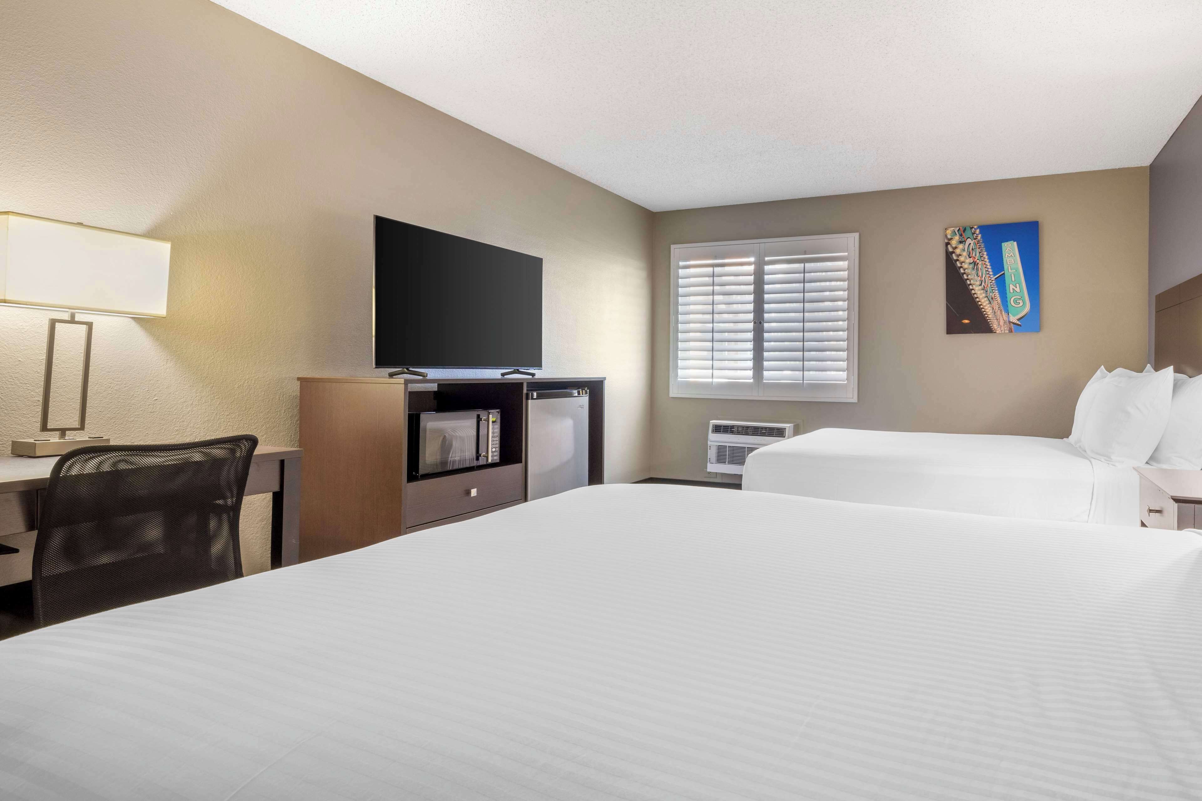 standard room, 2 queen beds, non smoking, refrigerator & microwave | in-room safe, individually decorated, desk, laptop workspace