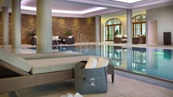 Relax by the pool with a view, surrounded by a seating area and lush greenery.