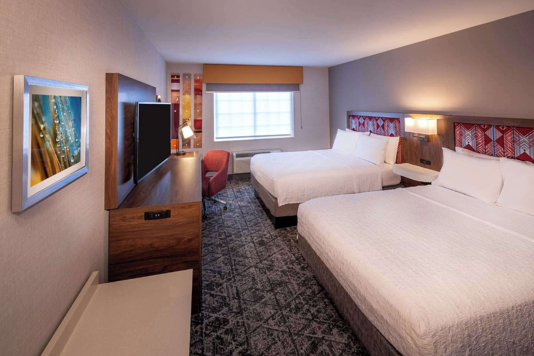 Hypo-allergenic bedding, desk, laptop workspace, blackout drapes