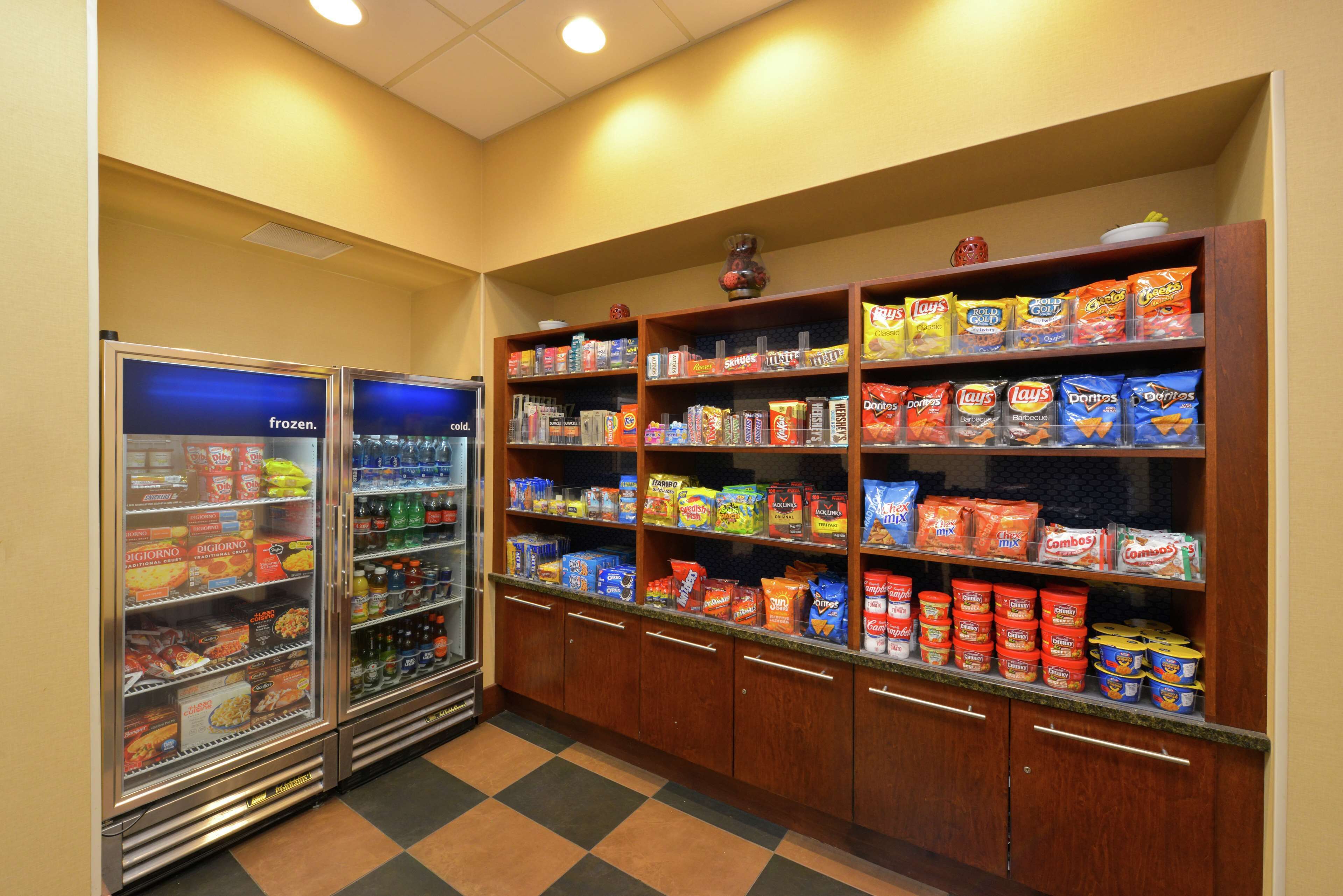 A snack vending area with various snack options and a refrigerated section.