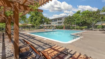 Outdoor pool, open 8 AM to 10 PM, pool loungers