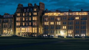 A historic hotel with multiple stories, large windows, and a prominent entrance.