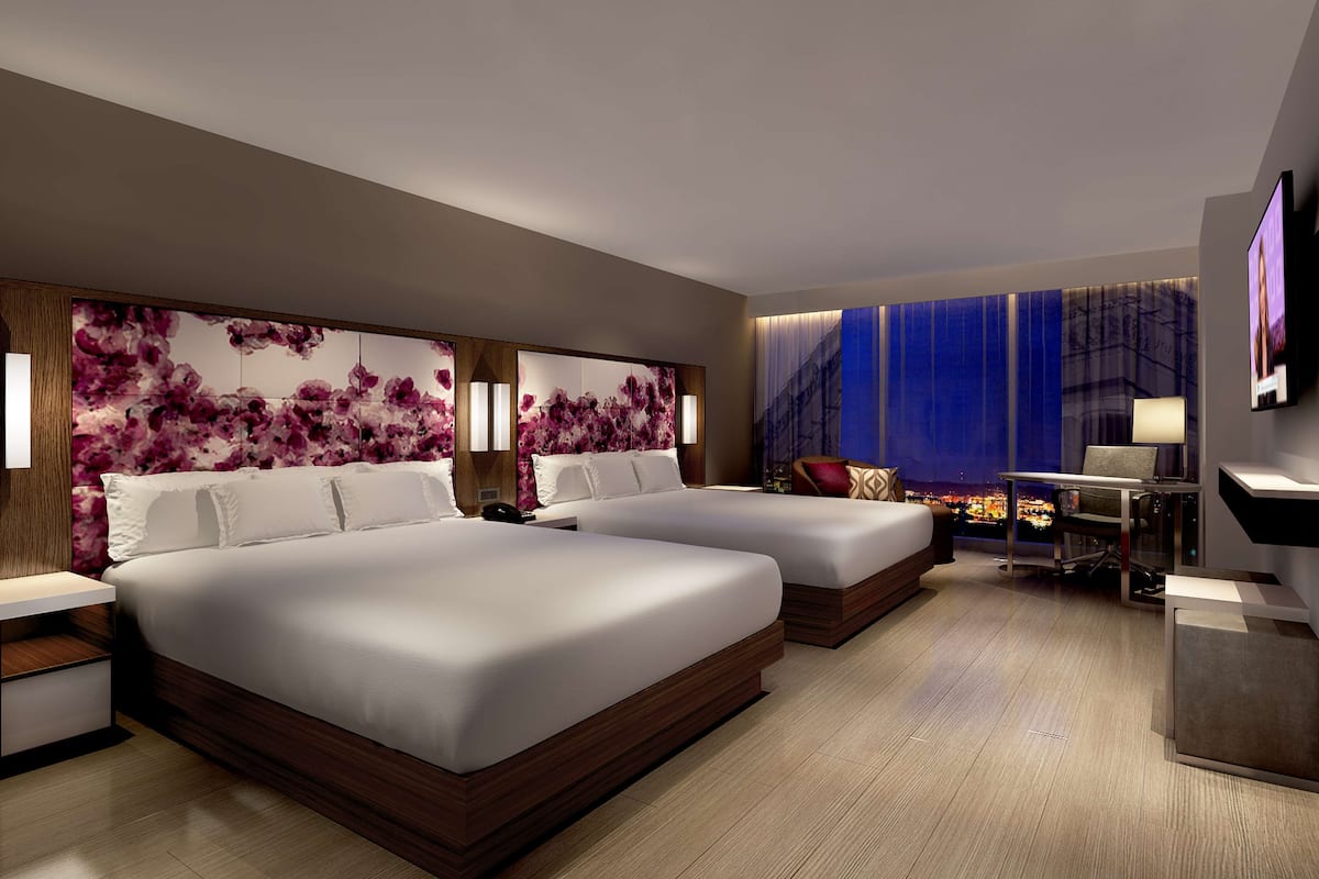 2 king beds deluxe pool view | premium bedding, in-room safe, desk, laptop workspace