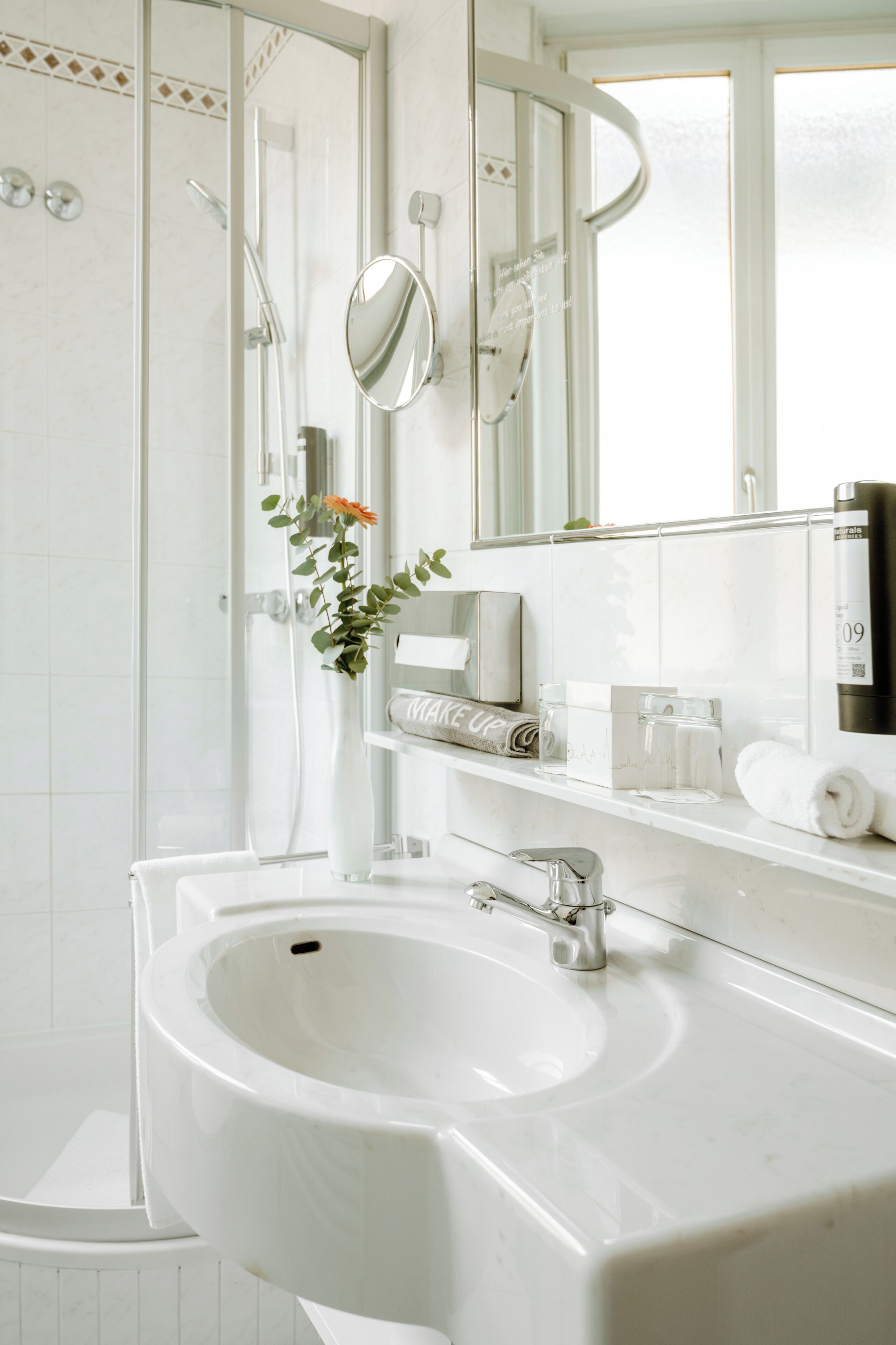 eco-friendly toiletries, hair dryer, towels