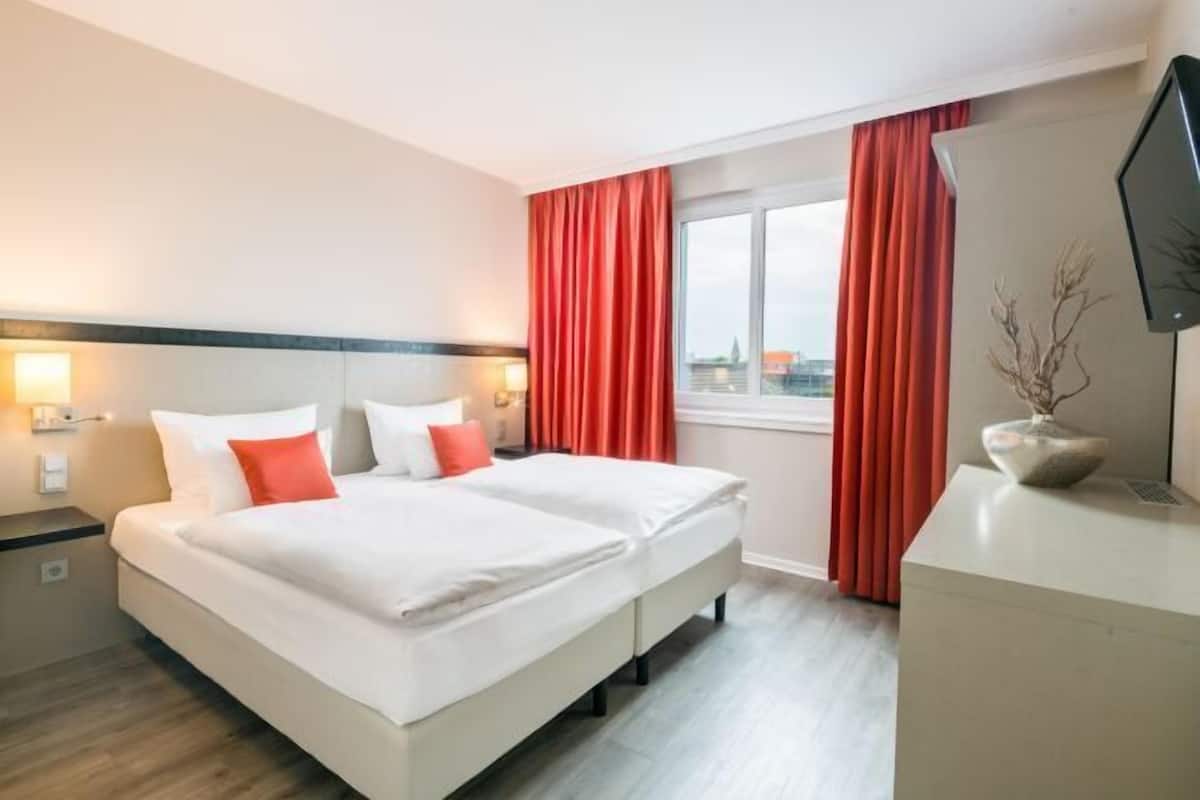 Hypo-allergenic bedding, down comforters, pillowtop beds, in-room safe