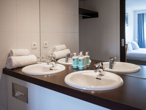 Suite, 1 King Bed | Bathroom | Eco-friendly toiletries, hair dryer, towels