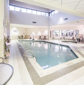 Indoor pool, pool umbrellas, sun loungers