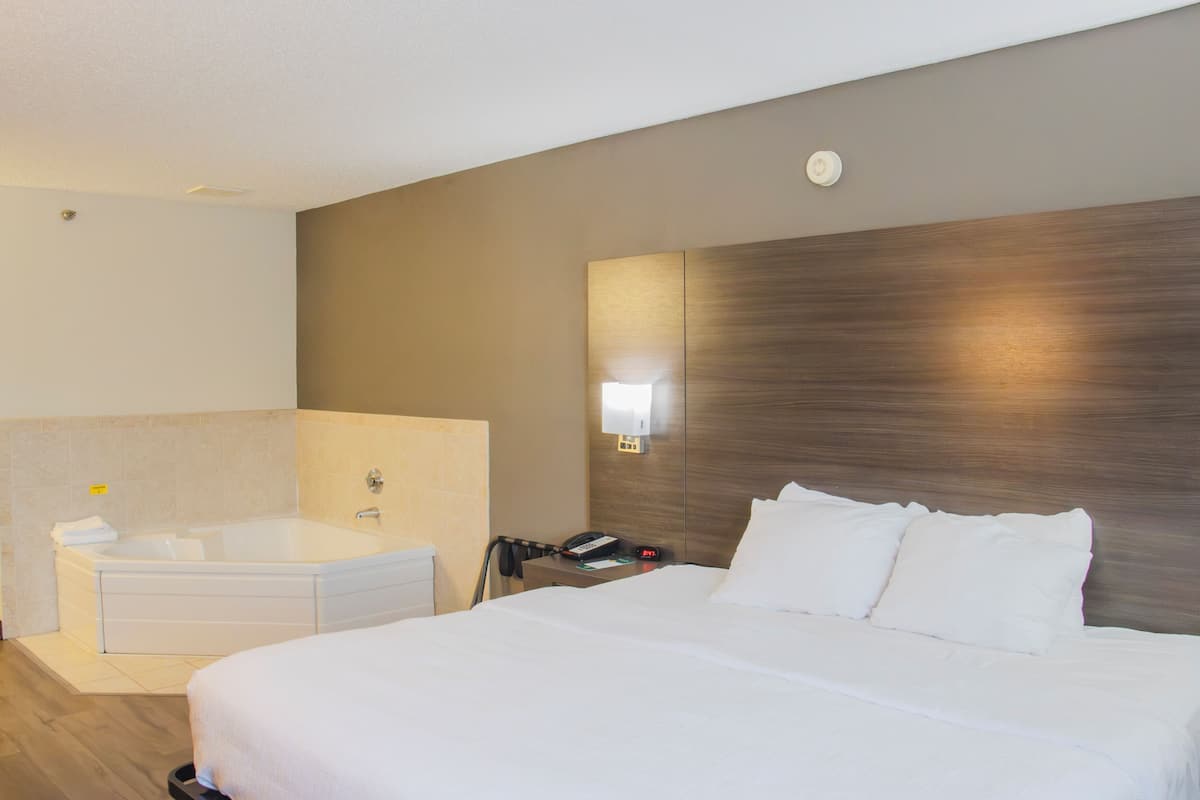 Premium bedding, desk, laptop workspace, iron/ironing board