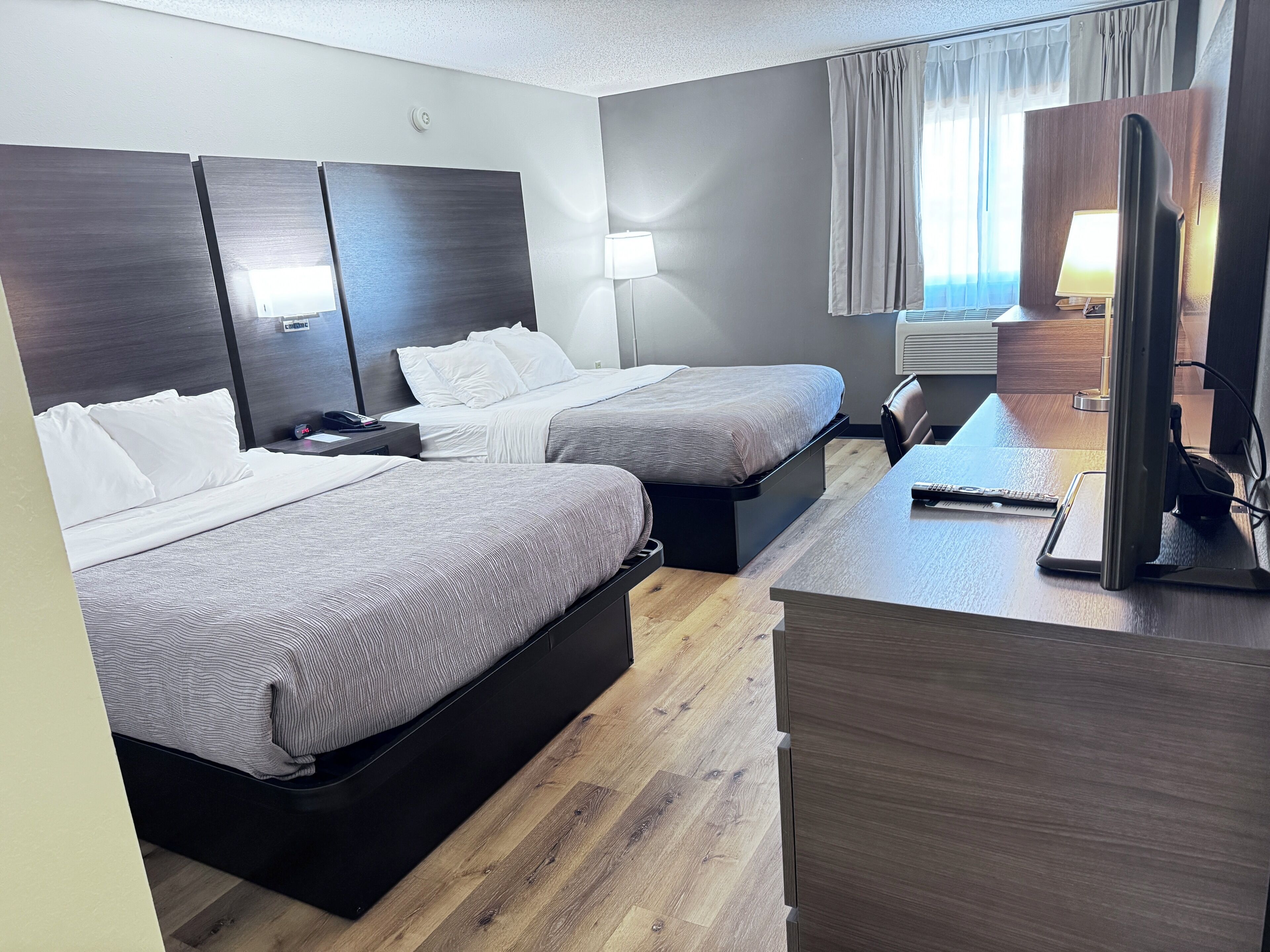 Premium bedding, desk, laptop workspace, iron/ironing board